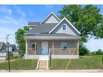 Charming two-story home with a welcoming front porch and well-maintained landscaping at 2170 S East St, Indianapolis, IN 46225