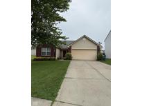 Charming single-story home with a well-manicured lawn and a two-car attached garage, featuring brick and siding accents at 8113 Maple Stream Ln, Indianapolis, IN 46217