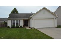 Charming single-Gathering home with a well-manicured lawn and attached two-car garage at 12389 Titans Dr, Fishers, IN 46037