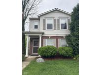 Charming two-story home with a well-manicured lawn and inviting front entrance at 12639 Justice Xing, Fishers, IN 46037