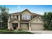 Two-story home showcasing a two-car garage, lovely landscaping, and a charming front porch entrance at 16926 Daly Dr, Noblesville, IN 46062