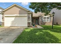 Charming single-Gathering home with attached garage, stone accents, and well-maintained lawn at 19489 Prairie Crossing Dr, Noblesville, IN 46062
