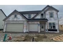 Two-story home featuring an attached garage, covered in Tyvek, and is currently under construction at 19976 Stone Side Dr, Westfield, IN 46074