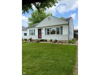 Charming single-story home featuring a landscaped front yard and inviting entrance at 472 N 17Th St, Noblesville, IN 46060