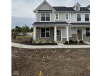 Charming two-story home features stone accents, modern design, and a welcoming entryway at 8568 Goldfinch Rd, Brownsburg, IN 46112