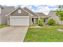 Charming single-story home with a two-car garage, brick accents, and a well-maintained lawn at 1181 S Aberdeen Dr, Franklin, IN 46131