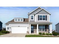 Charming two-story home featuring a two-car garage and a welcoming front porch at 1328 Plover Dr, Greenwood, IN 46143