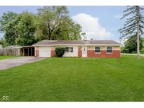 Charming one story home with attached garage, carport, and well maintained lawn at 4514 Priscilla Ave, Indianapolis, IN 46226