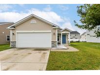 Charming single-story home with a two-car garage, stone accents, and a well-maintained lawn at 5775 Bluff View Ln, Whitestown, IN 46075
