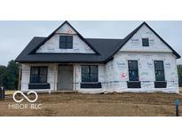 Modern farmhouse exterior elevation with black windows and roof during construction phase at 6638 Dogwood Dr, McCordsville, IN 46055