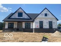 New home featuring black brick, a dark shingled roof, and dark trim at 6638 Dogwood Dr, McCordsville, IN 46055