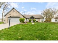 Charming single-story home with a brick and vinyl exterior, well-maintained lawn, and mature landscaping at 8038 Midlothian Way, Indianapolis, IN 46214