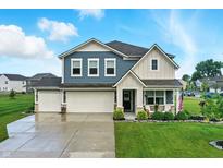 Charming two-story home with three-car garage and beautiful landscaping, perfect for curb appeal at 8547 Winton Pl, Pendleton, IN 46064