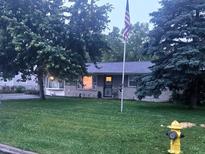 Charming single-story home featuring a well-maintained lawn and an American flag in the front yard at 9470 N Old Port Royal, Martinsville, IN 46151