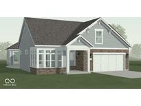 Charming home with a stone front, light blue siding, and a two-car garage at 14892 Higgins Dr, Westfield, IN 46074