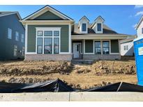 Charming new construction home with green siding, white trim, and brick accents at 15352 Cardonia Rd, Fishers, IN 46037