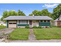 Charming single-story home with a well-maintained lawn and landscaping in a suburban neighborhood at 414 S Green St, Brownsburg, IN 46112