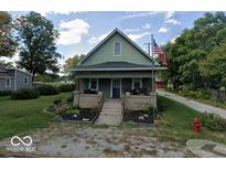Charming two-story home features a cozy front porch and a well-maintained lawn and landscaping at 50 Pearl St, Cicero, IN 46034