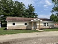 Charming single story home featuring stone facade and cozy front porch at 321 S 23Rd St, Elwood, IN 46036