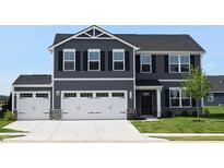 Charming two-story home with a three-car garage and manicured front lawn at 7153 Sultans Run Ln, Whitestown, IN 46075