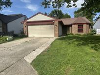 Charming single-story home with a two-car garage and well-maintained lawn at 8849 Summer Walk E Dr, Indianapolis, IN 46227