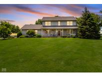Charming two-story home with a well-manicured lawn and a welcoming front porch for relaxing evenings at 12251 E 196Th St, Noblesville, IN 46060