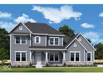 Charming two-story home featuring gray siding, a covered front porch, and beautifully landscaped surroundings at 15926 Bellows Ave, Fishers, IN 46040