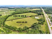 Aerial view of a large lot at 3302 W 450 N and 4535 US-52 surrounded by greenery at 4535 N Us Hwy 52, Thorntown, IN 46071