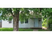 Charming single-Gathering home with a light blue door and a well-maintained lawn at 5344 Fletcher Ave, Indianapolis, IN 46219
