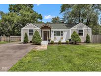 Charming home featuring classic architecture, a quaint front porch, and well-maintained landscaping at 6741 Evanston Ave, Indianapolis, IN 46220
