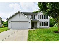 Charming two-story home featuring a two-car garage, green lawn, and classic architectural design at 5759 Columbia S Cir, Greenwood, IN 46142