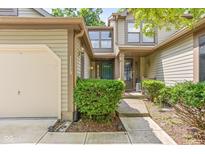 Charming home featuring a welcoming front entrance with well-maintained landscaping and inviting curb appeal at 11529 Sunset Cove Ln # 11529, Indianapolis, IN 46236