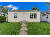 Cozy single-story home with a well-manicured lawn and inviting entrance at 2350 E Legrande Ave, Indianapolis, IN 46203