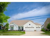 Charming single-Gathering home boasting a three car garage, manicured lawn, and beautiful landscaping at 5294 Lndg Pl Ln, Noblesville, IN 46062