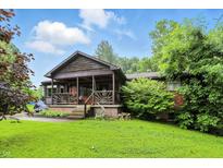 Charming home with a cozy covered front porch and well-maintained lawn at 6655 Teeters Ln, Martinsville, IN 46151