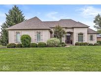 Charming single-story home with a brick facade, arched entryway, and well-manicured front lawn at 2920 Bloomsbury S, Greenwood, IN 46143