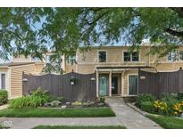 Inviting townhome featuring a well-maintained front yard and a charming fence at 5152 Coppertree Ln, Avon, IN 46123