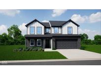 Charming two-story home with black accents, a well-manicured lawn, and a two car attached garage at 588 Arkansas Ln, Westfield, IN 46074