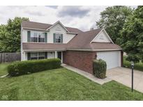 Charming two-story home featuring a brick-accented facade, attached garage, and well-manicured lawn at 7914 Willow Wind Cir, Indianapolis, IN 46239