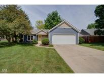 Charming single-Gathering home with blue siding, a two-car garage, and a well-manicured front yard at 9170 Andiron Way, Indianapolis, IN 46250