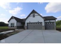 Charming home featuring a gray roof, three-car garage and light siding at 10424 Oak Bend Blvd, Indianapolis, IN 46239