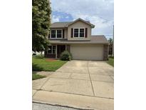 Charming two-story home featuring red shutters, a two car garage, and a concrete driveway at 19236 Fox Chase Dr, Noblesville, IN 46062