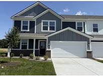 Charming two-story home with gray siding, white trim, a two-car garage, and a well-maintained front lawn at 2954 Grand Rdg Dr, Greenwood, IN 46143