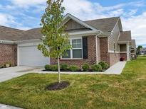 Charming brick home with a well-maintained lawn and attached garage at 610 Sawtooth St, Westfield, IN 46074