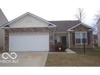 Charming single-story home featuring a brick facade, attached garage, and well-maintained lawn at 12451 Cricket Song Ln, Noblesville, IN 46060