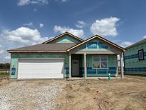 New construction with a white garage door, gray trim, and green weather-resistant barrier under a partly cloudy sky at 201 Holly Ln, Greenfield, IN 46140