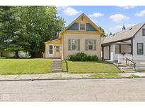 Charming home with well-kept lawn and inviting entrance, perfect for a starter Gathering at 29 E Caven St, Indianapolis, IN 46225