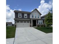 Beautiful two-story home featuring a two-car garage and a well-manicured lawn at 3068 Gibbert Ln, Westfield, IN 46074