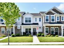 Inviting townhouse exteriors with manicured lawns and charming front porches create a welcoming curb appeal at 3443 Thomas Jefferson St, Westfield, IN 46074