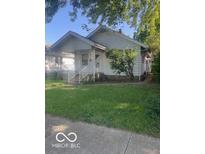 Charming single-story home with a welcoming front porch and well-maintained lawn at 416 W 21St St, Anderson, IN 46016